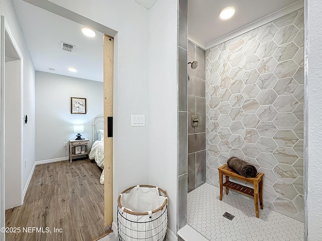 540485 US Highway 1, Callahan, FL 32011 - bathroom featuring tiled shower and wood finished floors