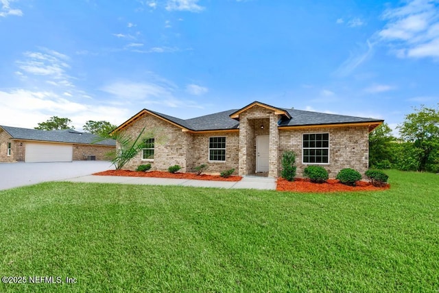 451632 Old Dixie Hwy, Callahan, FL 32011 - ranch-style home with a front lawn, brick siding, and concrete driveway