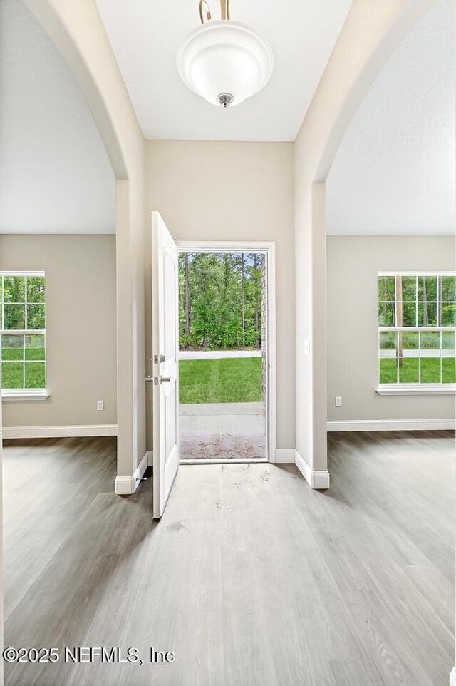 451632 Old Dixie Hwy, Callahan, FL 32011 - entryway featuring arched walkways, wood finished floors, and plenty of natural light