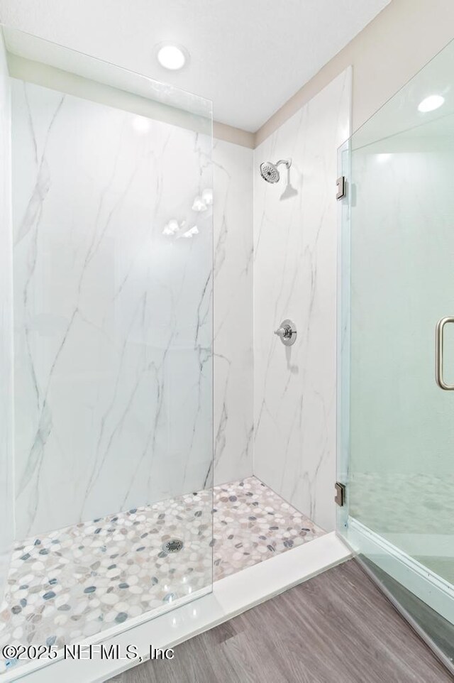 451632 Old Dixie Hwy, Callahan, FL 32011 - full bathroom featuring a marble finish shower, wood finished floors, and recessed lighting
