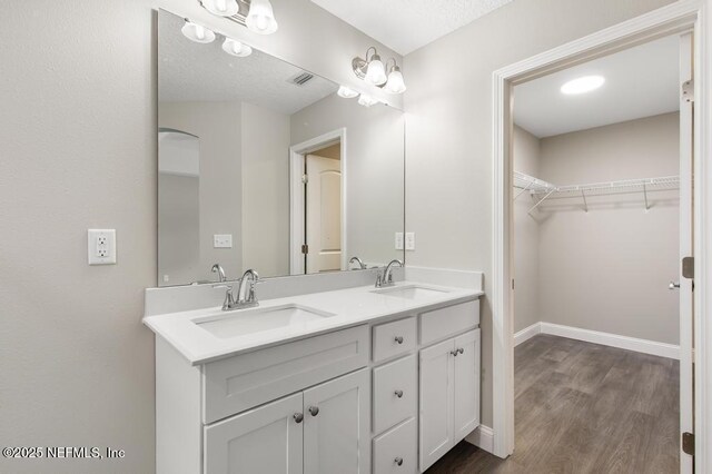 451632 Old Dixie Hwy, Callahan, FL 32011 - full bath featuring double vanity, wood finished floors, and a spacious closet