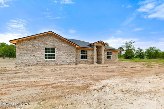 451632 Old Dixie Hwy, Callahan, FL 32011 - view of front of home featuring brick siding and roof with shingles