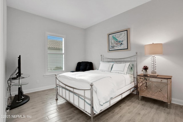 2459 Karatas Ct, Jacksonville, FL 32246 - bedroom with light wood-style floors and baseboards