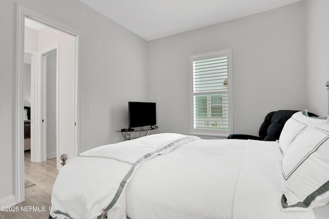 2459 Karatas Ct, Jacksonville, FL 32246 - bedroom with light wood finished floors and baseboards