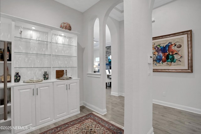2459 Karatas Ct, Jacksonville, FL 32246 - bar featuring arched walkways and light wood-style flooring