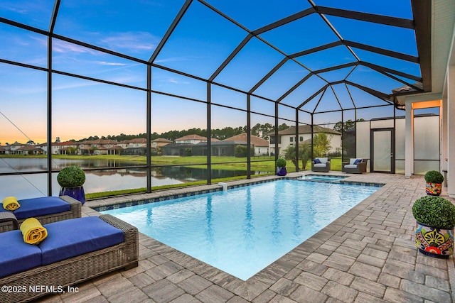 2459 Karatas Ct, Jacksonville, FL 32246 - view of pool with a patio, a water view, a pool with connected hot tub, a lanai, and a residential view