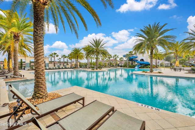 2459 Karatas Ct, Jacksonville, FL 32246 - community pool featuring a water slide and a patio area