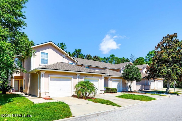 307 Southern Branch Ln, Saint Johns, FL 32259 - view of front of home featuring stucco siding, driveway, and a garage