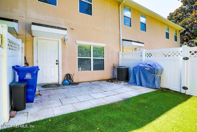 307 Southern Branch Ln, Saint Johns, FL 32259 - rear view of house featuring stucco siding and a patio