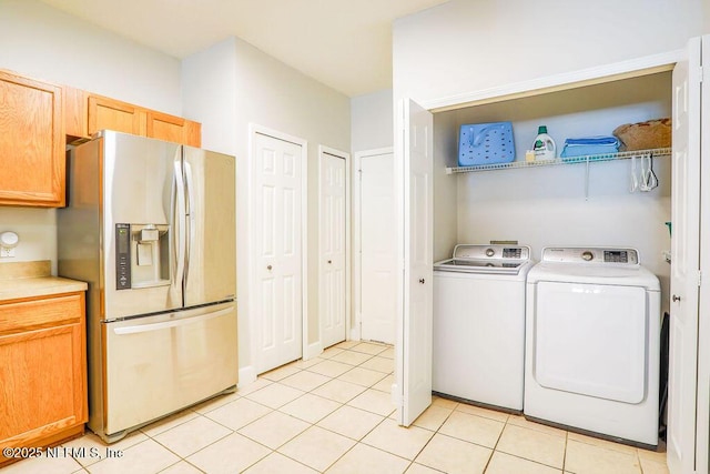 307 Southern Branch Ln, Saint Johns, FL 32259 - washroom with light tile patterned flooring and separate washer and dryer