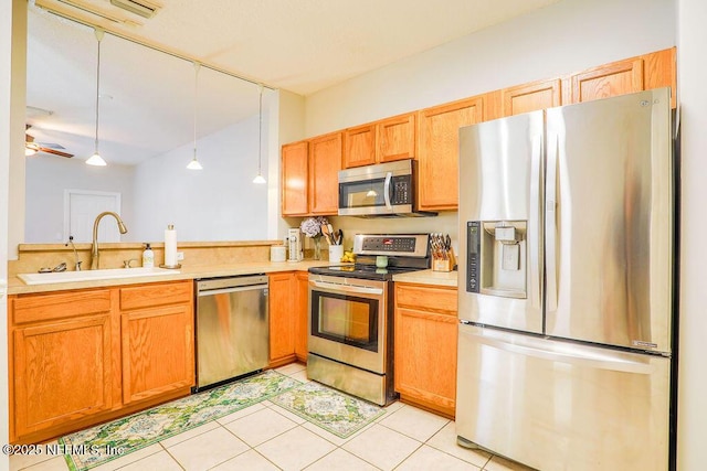 307 Southern Branch Ln, Saint Johns, FL 32259 - kitchen with appliances with stainless steel finishes, light countertops, decorative light fixtures, light tile patterned floors, and a peninsula