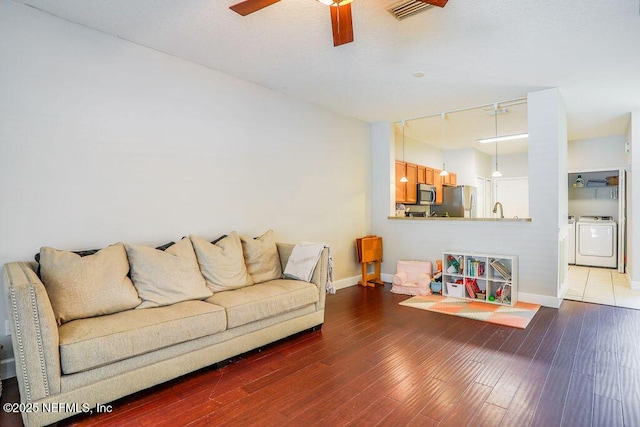 307 Southern Branch Ln, Saint Johns, FL 32259 - living area featuring washer / clothes dryer, ceiling fan, and wood finished floors