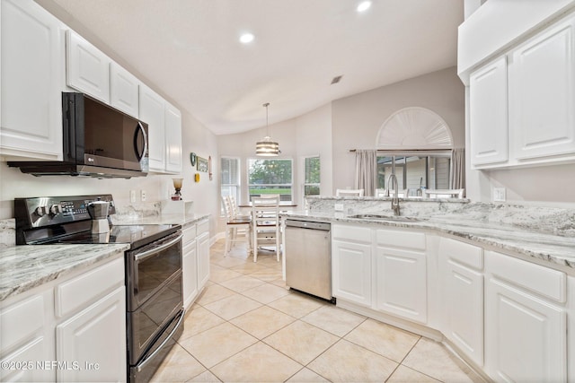 1630 Highland View Ct, Fleming Island, FL 32003 - kitchen with appliances with stainless steel finishes, vaulted ceiling, recessed lighting, white cabinetry, and light tile patterned flooring