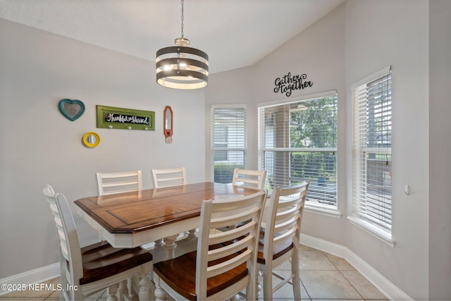 1630 Highland View Ct, Fleming Island, FL 32003 - dining area with healthy amount of natural light, a chandelier, light tile patterned floors, and lofted ceiling