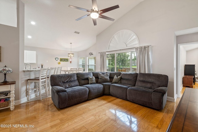 1630 Highland View Ct, Fleming Island, FL 32003 - living room with ceiling fan, light wood finished floors, high vaulted ceiling, and recessed lighting