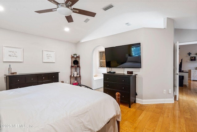 1630 Highland View Ct, Fleming Island, FL 32003 - bedroom featuring vaulted ceiling, light wood-style floors, arched walkways, recessed lighting, and a ceiling fan