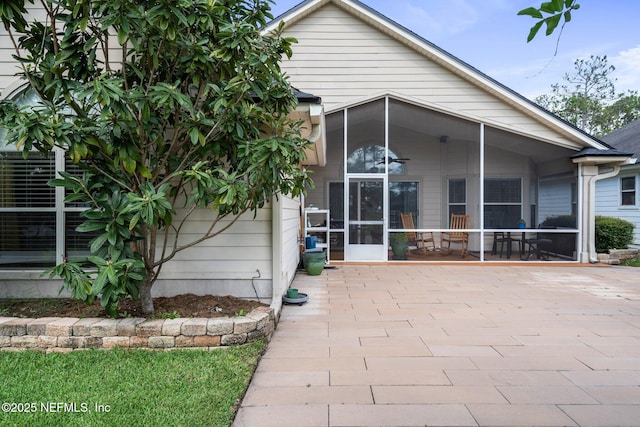 1630 Highland View Ct, Fleming Island, FL 32003 - rear view of house featuring a sunroom and a patio