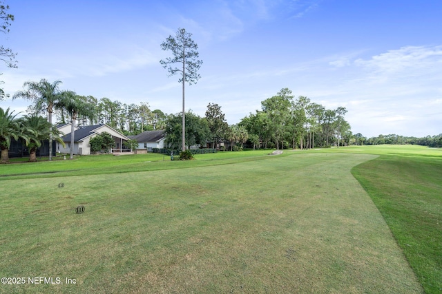 1630 Highland View Ct, Fleming Island, FL 32003 - surrounding community with golf course view, a yard, and view of scattered trees