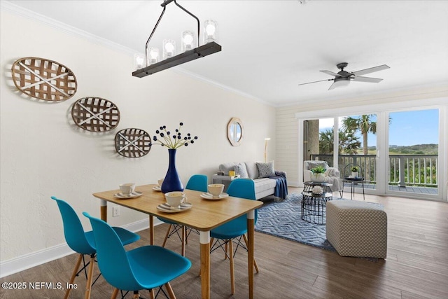 3385 Coastal Hwy Unit 23, Saint Augustine, FL 32084 - dining room featuring wood finished floors, crown molding, and ceiling fan