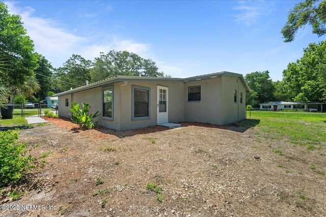 1622 Roselle Ave, Palatka, FL 32177 - view of front of property with stucco siding and a gate