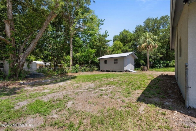 1622 Roselle Ave, Palatka, FL 32177 - view of yard featuring view of wooded area and a shed