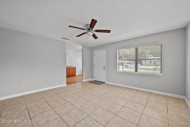 1622 Roselle Ave, Palatka, FL 32177 - tiled spare room featuring a ceiling fan and baseboards