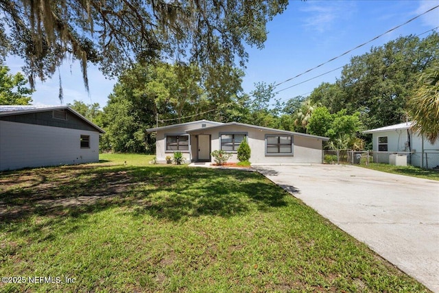 1622 Roselle Ave, Palatka, FL 32177 - mid-century modern home featuring driveway and stucco siding
