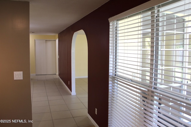 2590 Eastill Dr, Jacksonville, FL 32211 - hallway with tile patterned floors and arched walkways