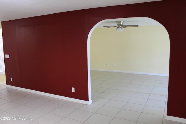 2590 Eastill Dr, Jacksonville, FL 32211 - unfurnished room featuring arched walkways, a ceiling fan, and light tile patterned floors