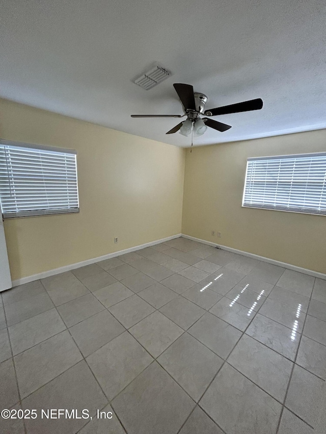 2590 Eastill Dr, Jacksonville, FL 32211 - spare room featuring tile patterned floors and ceiling fan