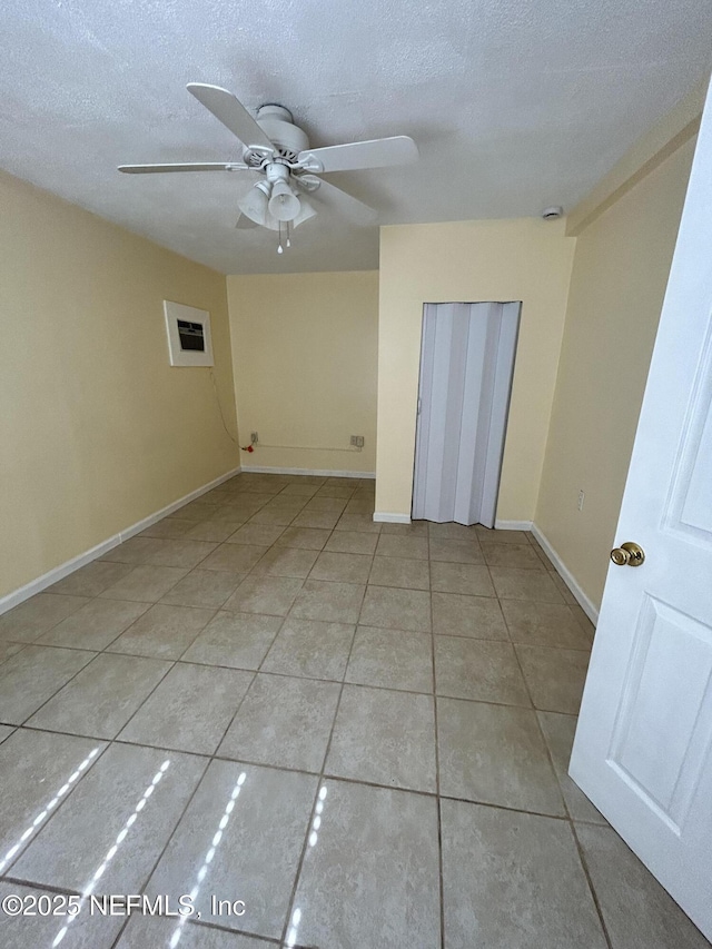 2590 Eastill Dr, Jacksonville, FL 32211 - unfurnished room with ceiling fan, tile patterned floors, and a textured ceiling