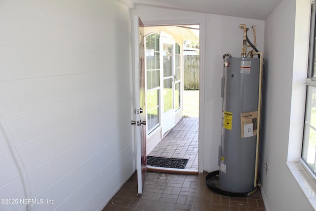2590 Eastill Dr, Jacksonville, FL 32211 - utility room featuring electric water heater