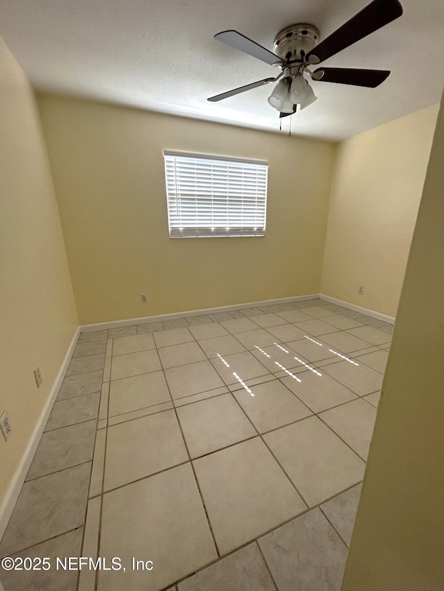 2590 Eastill Dr, Jacksonville, FL 32211 - spare room featuring light tile patterned floors and a ceiling fan