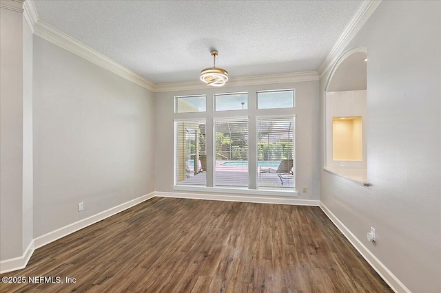 104 Haverhill Dr, Ponte Vedra Beach, FL 32082 - unfurnished dining area featuring dark wood-type flooring, crown molding, and a textured ceiling