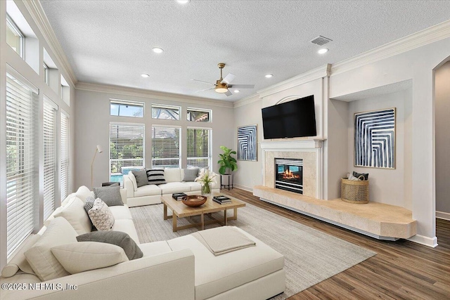 104 Haverhill Dr, Ponte Vedra Beach, FL 32082 - living area with a ceiling fan, crown molding, a premium fireplace, wood finished floors, and a textured ceiling