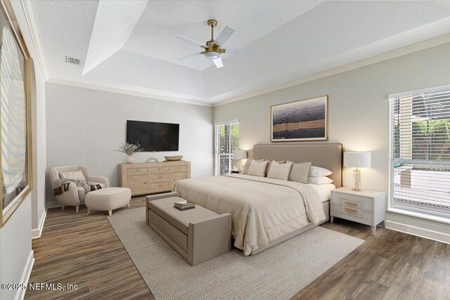 104 Haverhill Dr, Ponte Vedra Beach, FL 32082 - bedroom with wood finished floors, ornamental molding, a tray ceiling, ceiling fan, and vaulted ceiling