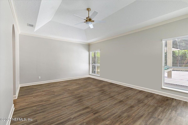 104 Haverhill Dr, Ponte Vedra Beach, FL 32082 - empty room with ornamental molding, a ceiling fan, dark wood-style floors, vaulted ceiling, and a tray ceiling