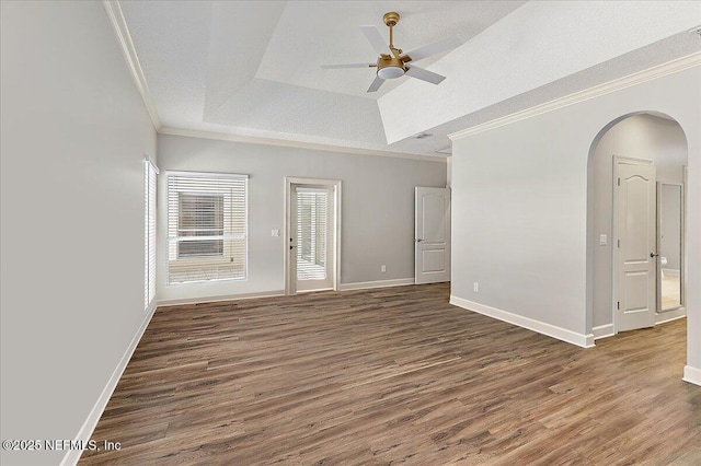 104 Haverhill Dr, Ponte Vedra Beach, FL 32082 - empty room featuring wood finished floors, ceiling fan, arched walkways, ornamental molding, and a tray ceiling