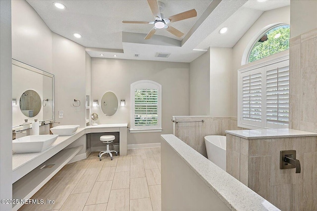 104 Haverhill Dr, Ponte Vedra Beach, FL 32082 - bathroom with ceiling fan, a freestanding bath, double vanity, plenty of natural light, and recessed lighting