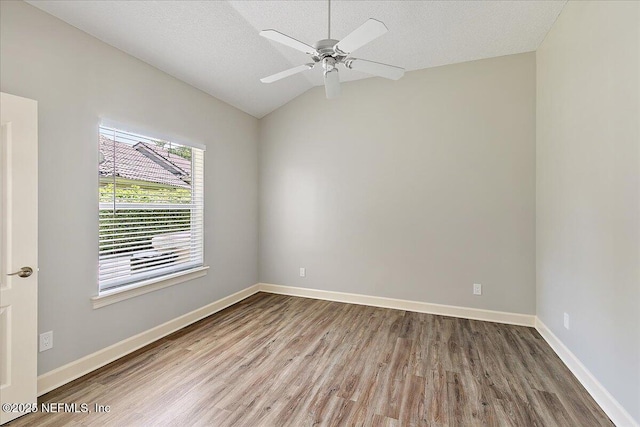 104 Haverhill Dr, Ponte Vedra Beach, FL 32082 - spare room with wood finished floors, vaulted ceiling, ceiling fan, and a textured ceiling