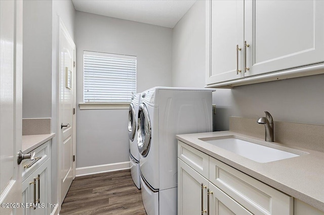 104 Haverhill Dr, Ponte Vedra Beach, FL 32082 - laundry area with washing machine and dryer, cabinet space, and dark wood finished floors