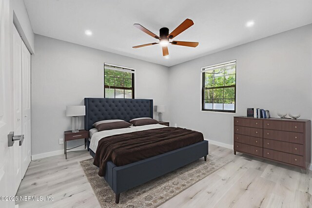 4903 Tennessee St, Jacksonville, FL 32208 - bedroom with multiple windows, light wood-type flooring, a ceiling fan, a closet, and recessed lighting