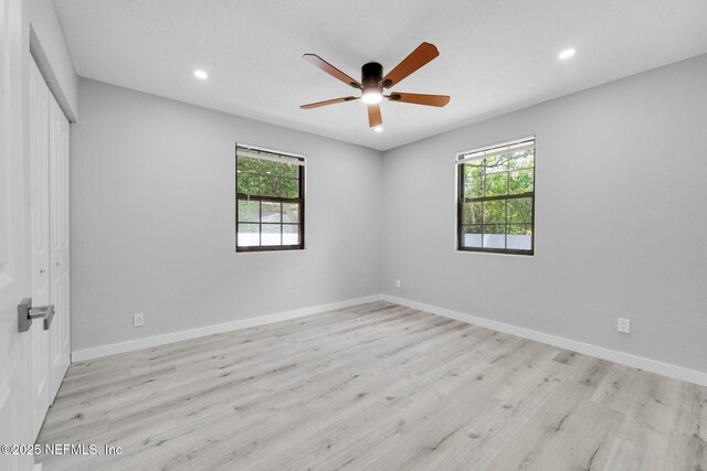 4903 Tennessee St, Jacksonville, FL 32208 - unfurnished bedroom featuring multiple windows, light wood-style flooring, a closet, recessed lighting, and a ceiling fan