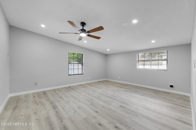 4903 Tennessee St, Jacksonville, FL 32208 - empty room with ceiling fan, wood finished floors, recessed lighting, and vaulted ceiling