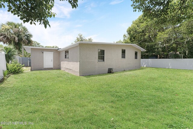 4903 Tennessee St, Jacksonville, FL 32208 - back of house featuring brick siding