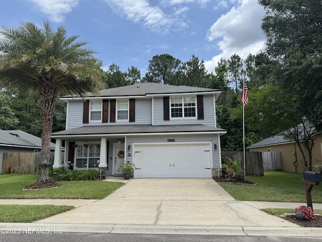 86163 Venetian Ave, Yulee, FL 32097 - traditional-style home with concrete driveway, an attached garage, and covered porch