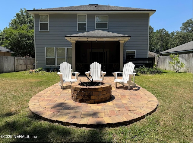 86163 Venetian Ave, Yulee, FL 32097 - rear view of house featuring a patio area, a fire pit, a fenced backyard, and roof with shingles