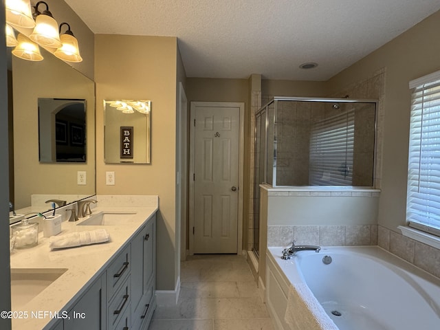 86163 Venetian Ave, Yulee, FL 32097 - bathroom featuring double vanity, a shower stall, a bath, a textured ceiling, and plenty of natural light