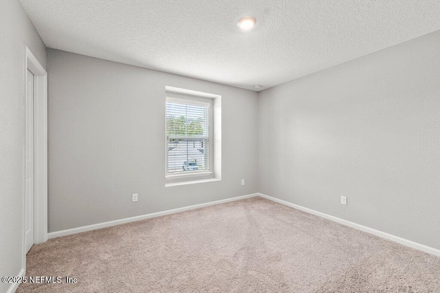 3283 Loblolly Pine Ct, Middleburg, FL 32068 - empty room featuring carpet flooring and a textured ceiling
