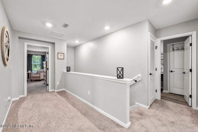 3283 Loblolly Pine Ct, Middleburg, FL 32068 - hall featuring an upstairs landing, carpet floors, and recessed lighting